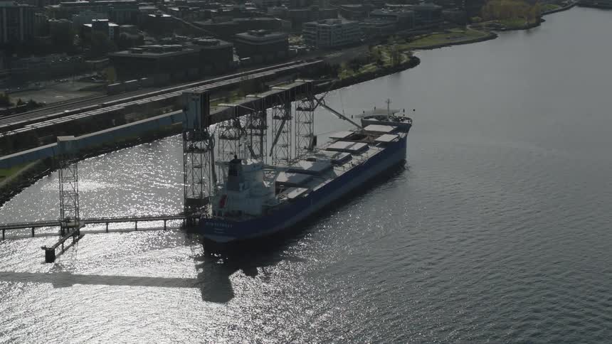 Large cargo ship at a dock