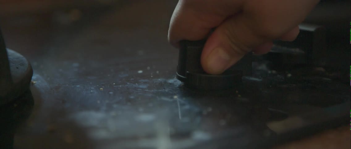 Hand turning a knob