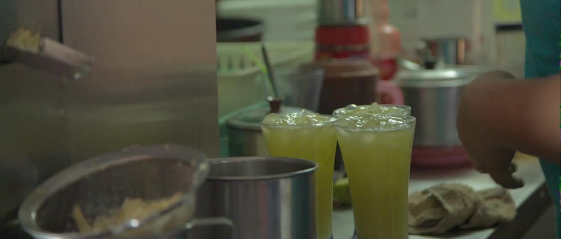 Beverages are poured from a large pitcher