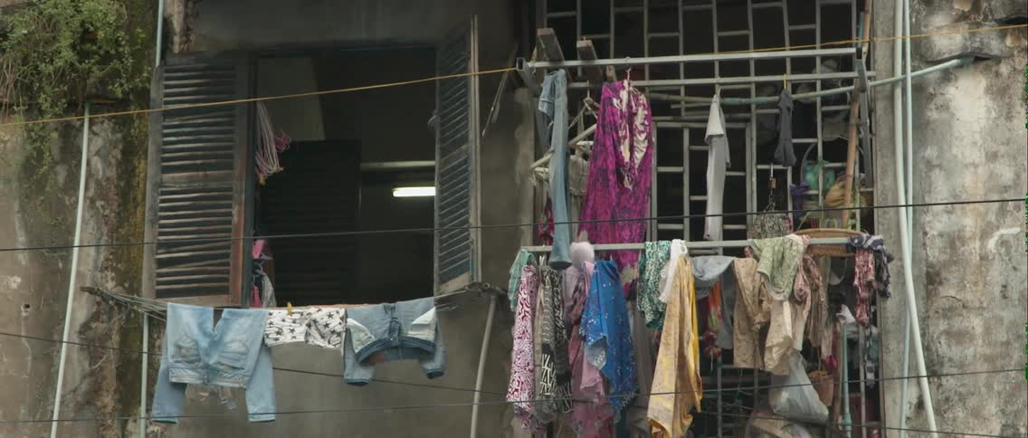 Clothes are hung on lines by this home