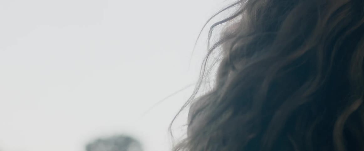 The wind blows through a woman's hair
