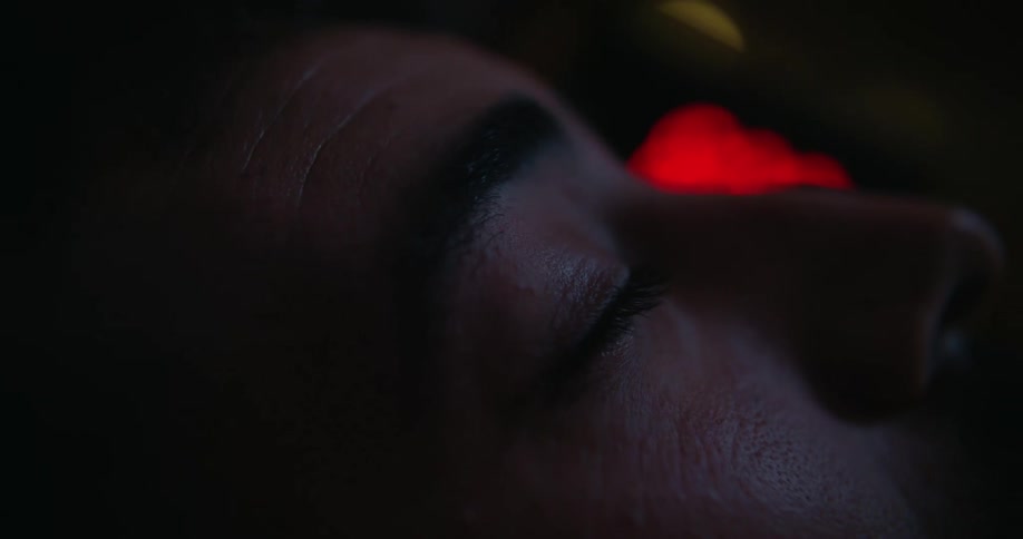 Close up view of a mans face while sleeping at night