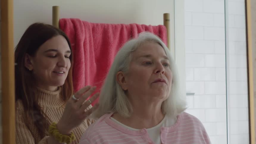 Family are hanging out in the bathroom