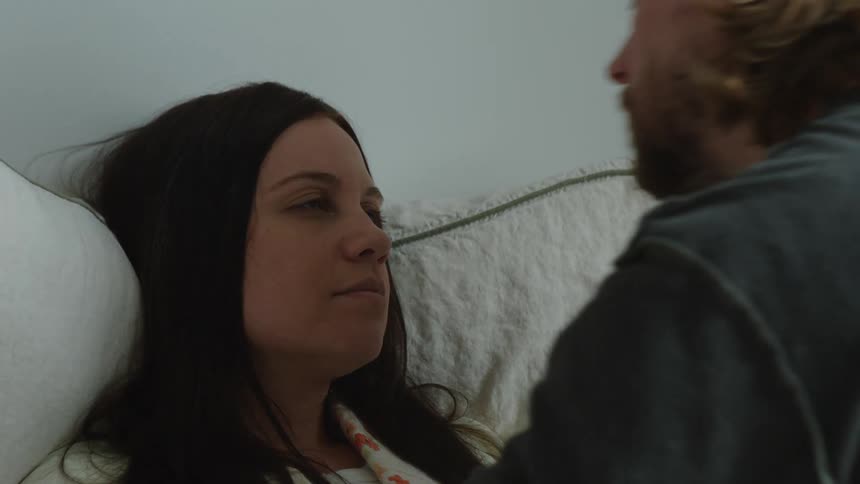 Man is showing affection to his wife indoors