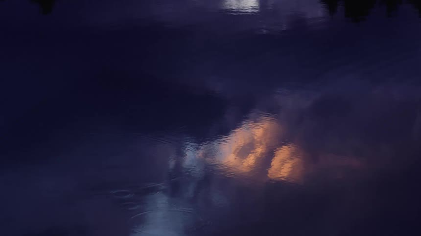 Rain drops in the water