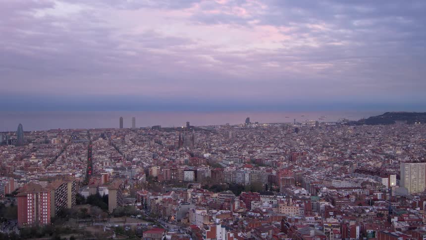 Aerial view of big coastal city during the day
