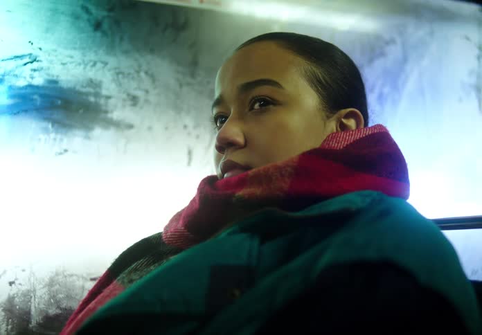 A woman is riding on the train