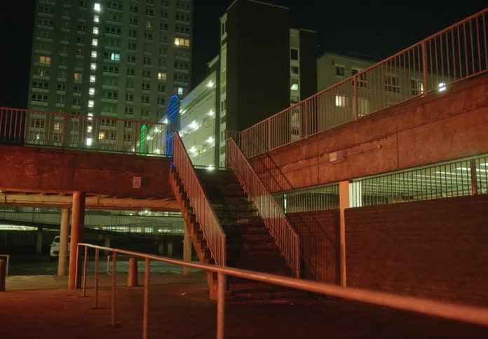 An empty bridge in a downtown city is displayed