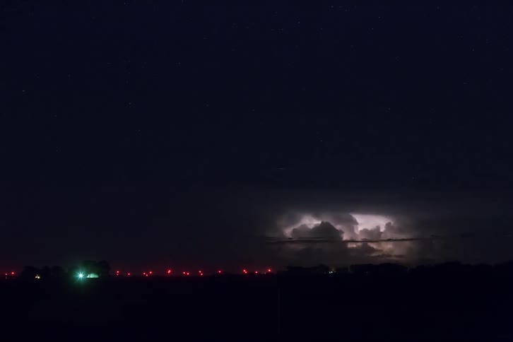 Time lapse of a storm with lightning going off over a town