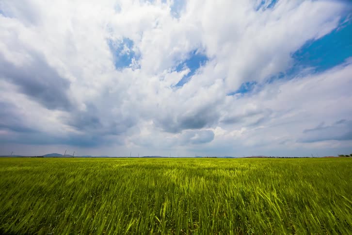Time lapse of clouds over a field