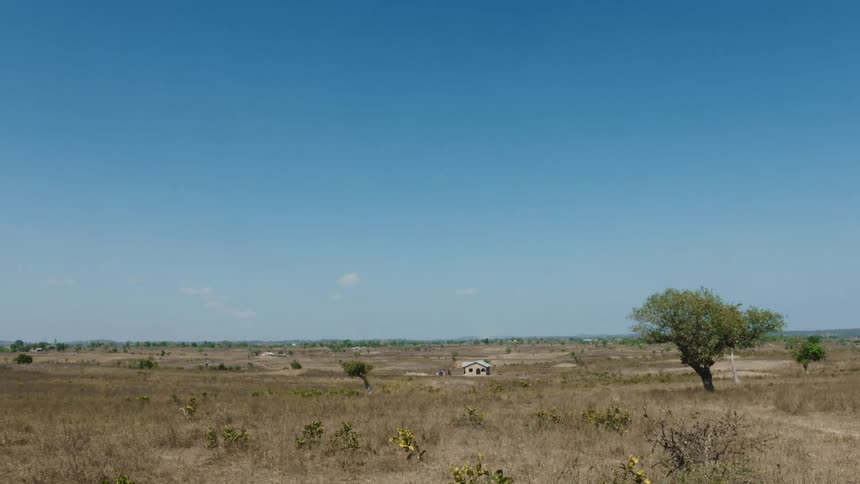 A home sits alone in a vast field