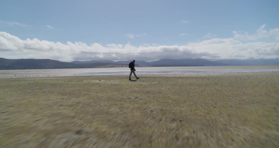 A man hiking out in a valley