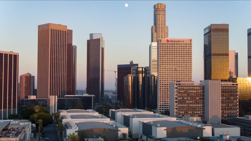 Aerial view of skyscrapers and high rise buildings at dawn