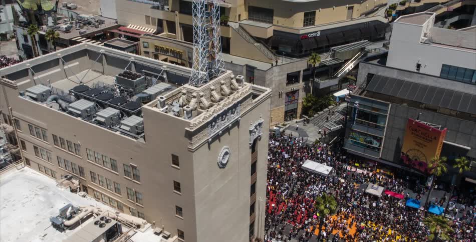 Aerial view of a large crowd of people in downtown area in the city
