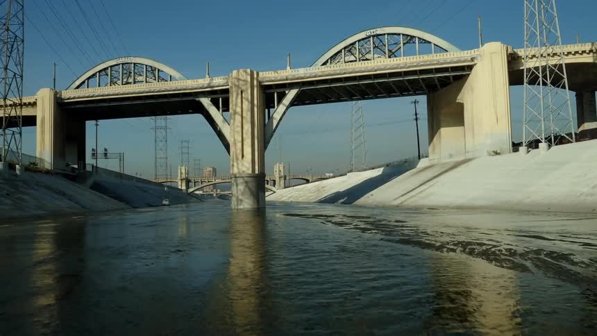 The view is of the city area and you can see a view of a bridge