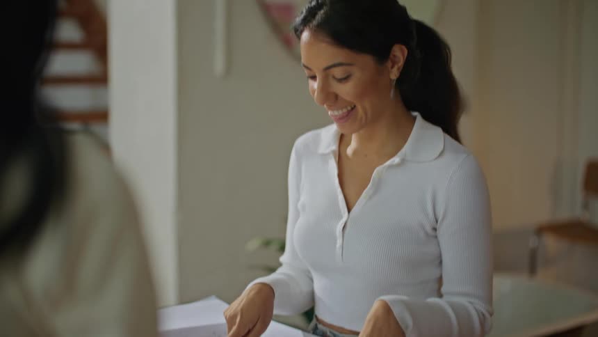 Women with white shirts work on plan at the office