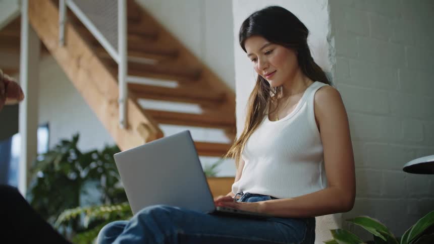 A mother father and child using a laptop in a room