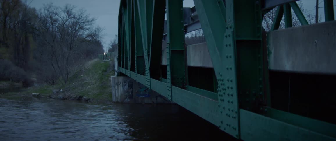 People travel over the small bridge