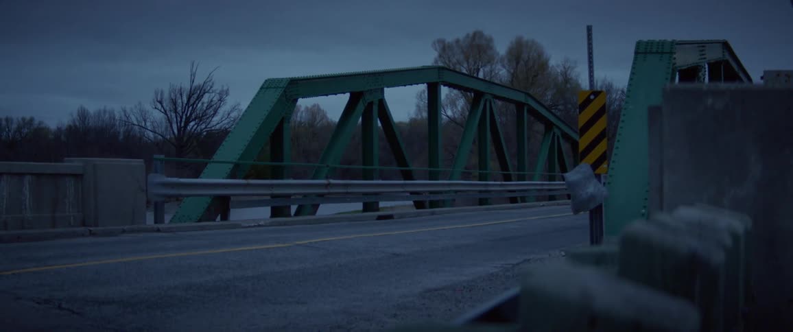 The cars drive over the bridge