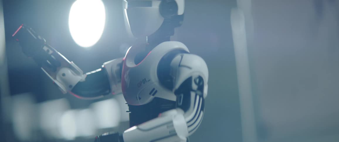 Robot spins around as it moves its arms up and down