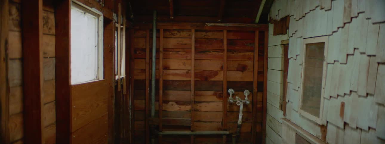 Interior of a wooden house with bare walls