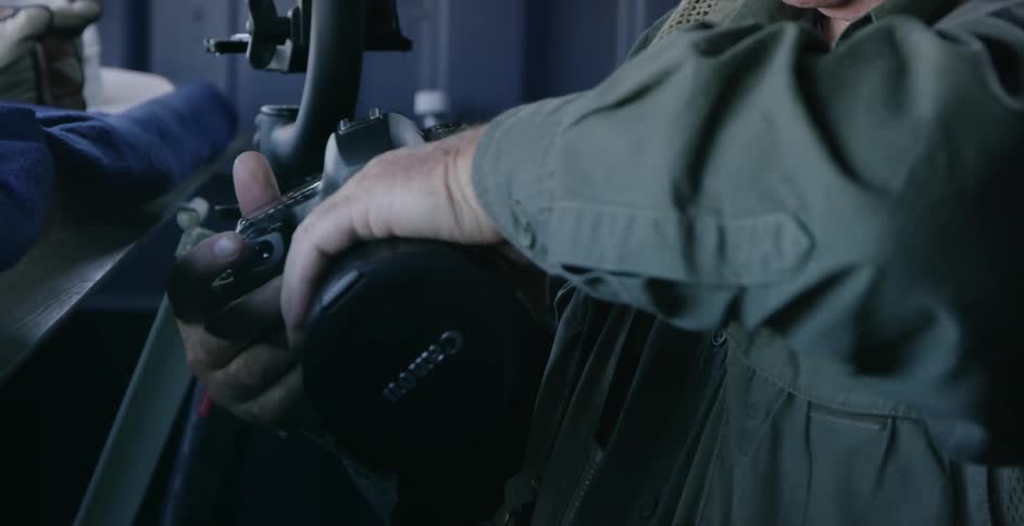 Man puts a new lens on his camera