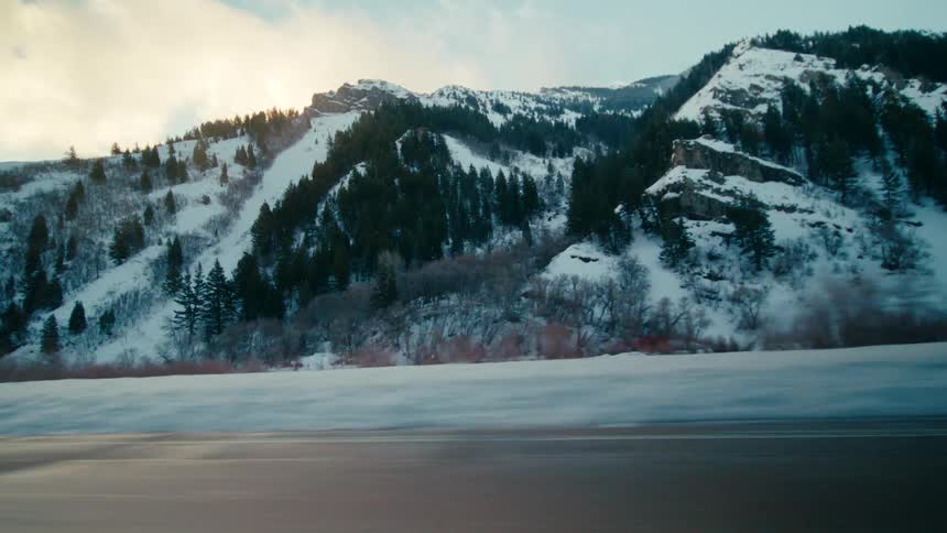 A view of mountains during winter is displayed