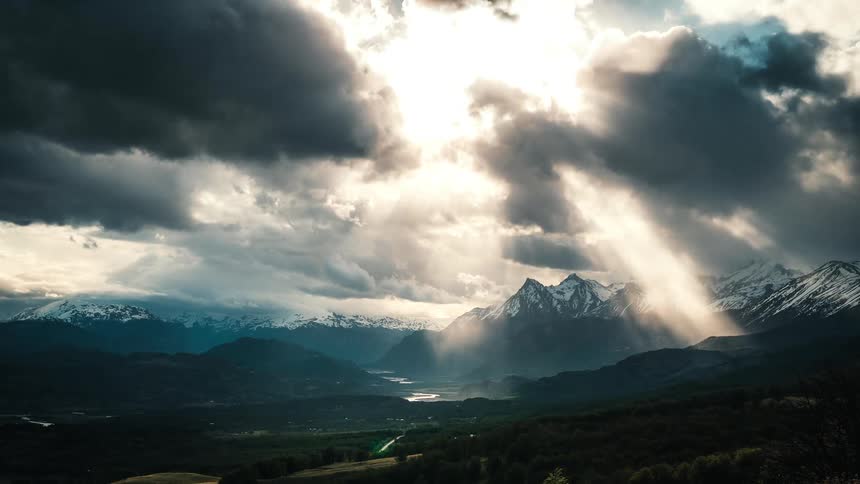 Time lapse view of a cloudy day over a mountain range