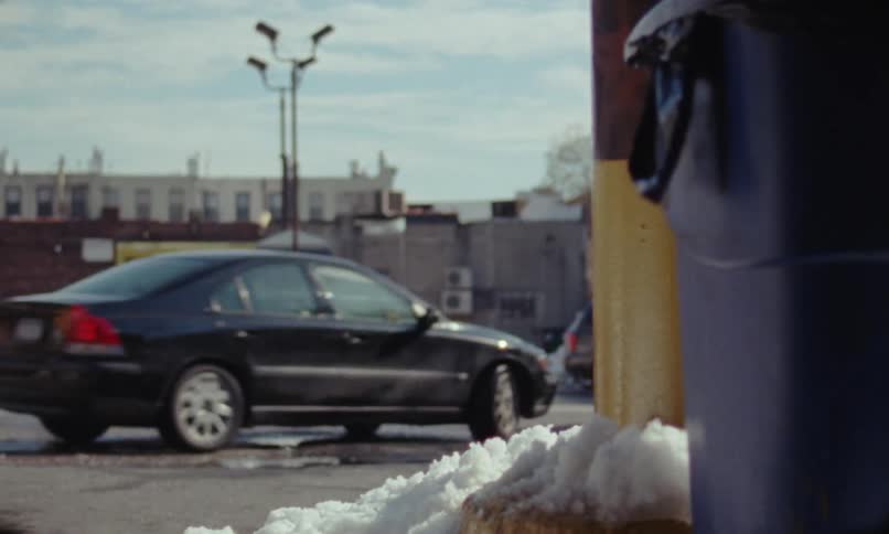 Car drives into a taxi parking garage at winter caught on vintage film