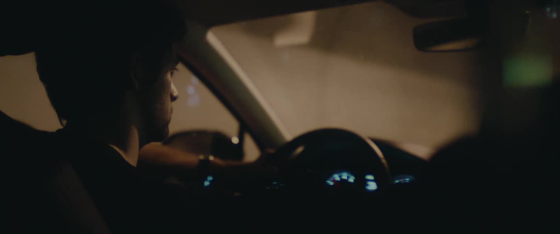 A male is driving a vehicle through a tunnel