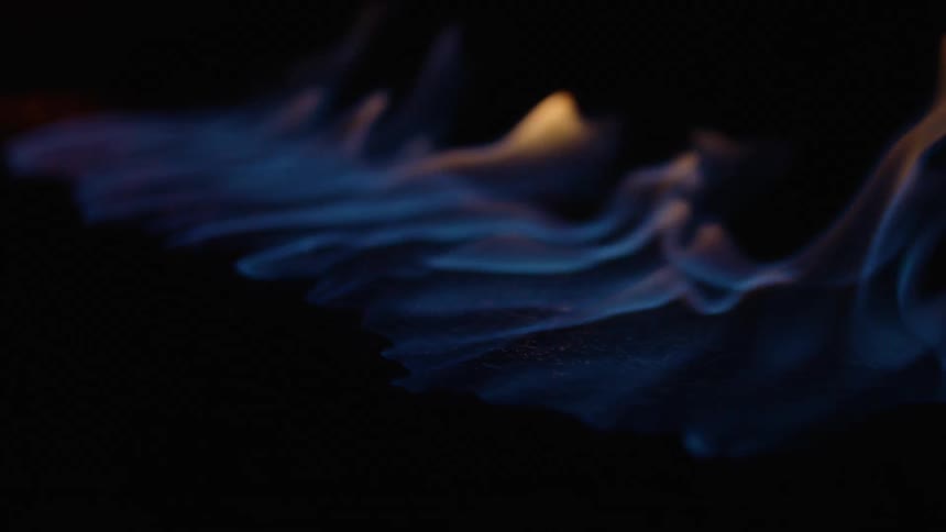 Fire moves across the floor scorching and burning as flames rise