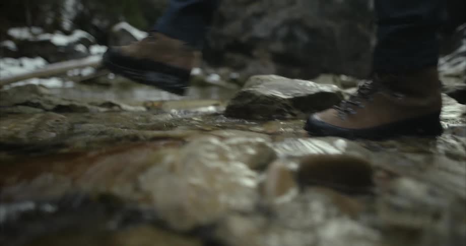A person is hiking across a rocky landscape