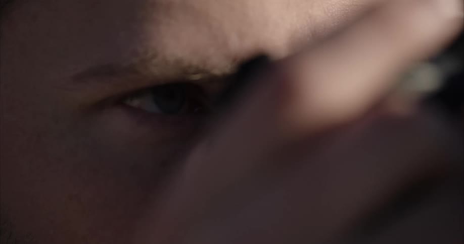 Man looks through camera viewfinder and clicks it to take a photo
