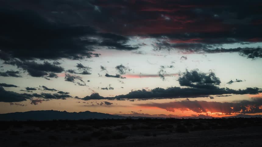Time lapse of sun going down over the hills