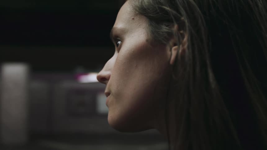 Close up view of a womans face is displayed