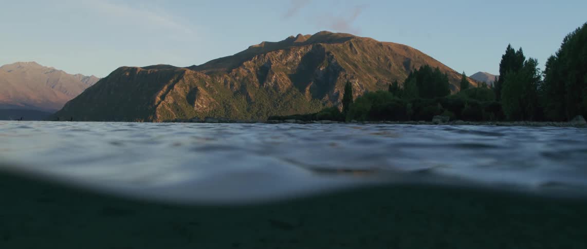 Water is moving near a mountain in spring