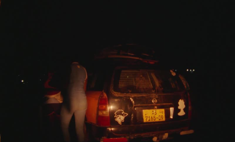 A group of women walking towards a car and getting into it at night