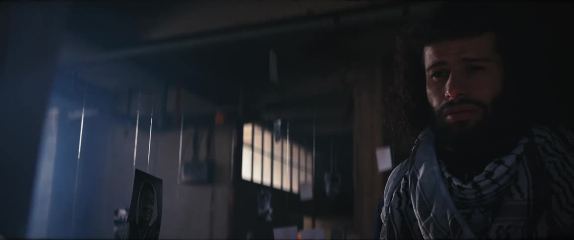 A young man is inside of a house and he looks upset
