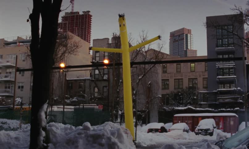The view is of a small town in the winter time