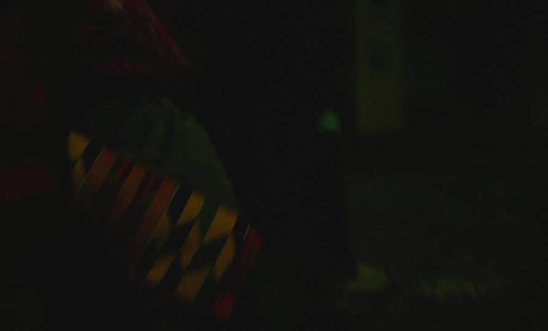 A group of friends are walking outdoors during the night time