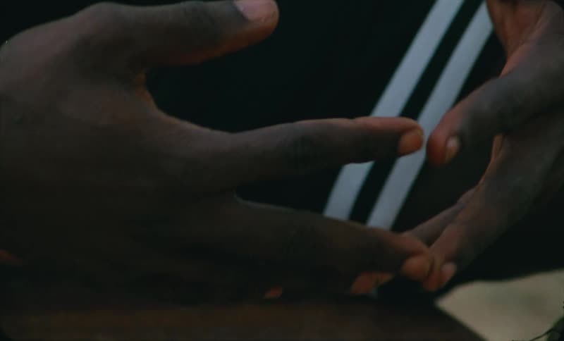 Person touches the tips of their hands together