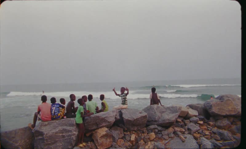 Children play together by the water