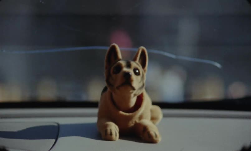 Shaking head dog decoration in car