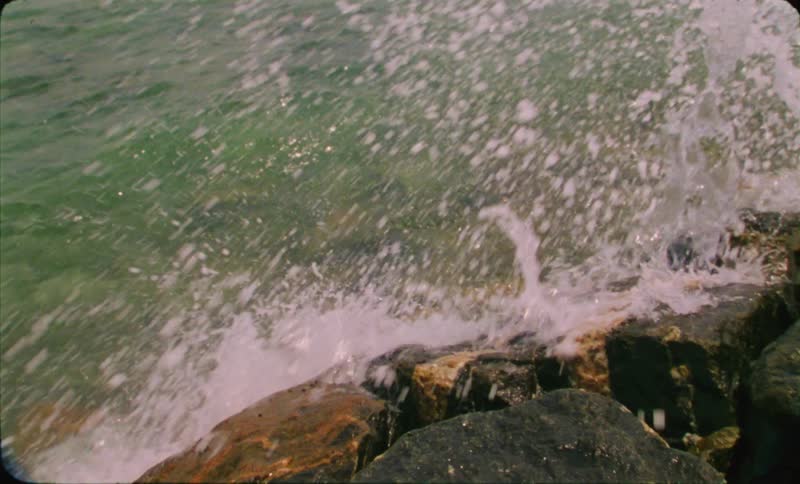 A shot of waves crashing on rocks