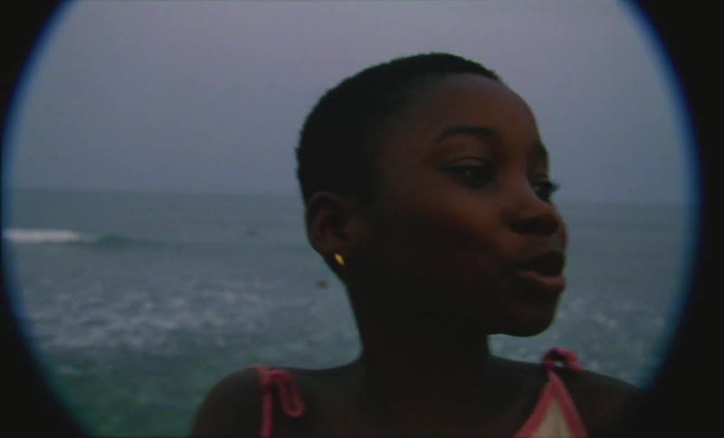 A girl talking to a man after making the hearing sign
