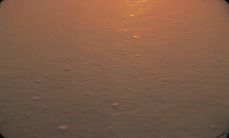 The view of ocean water while the sun is setting