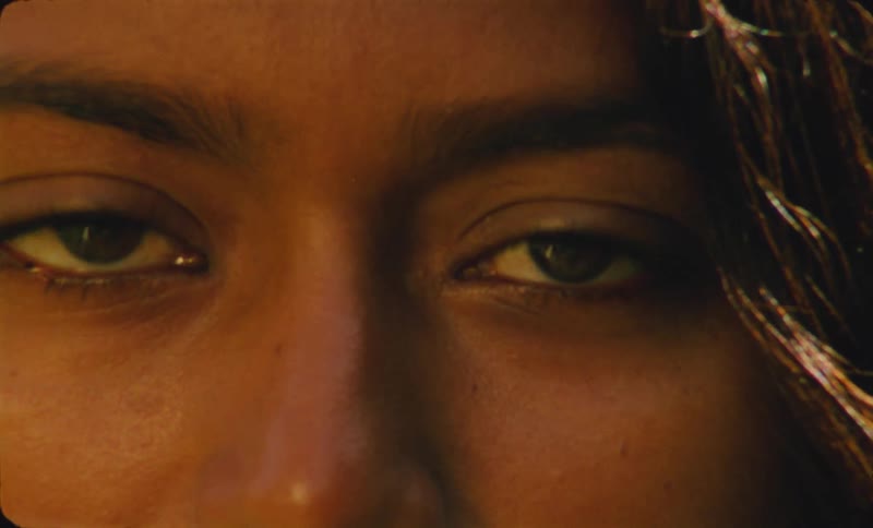 The view is of a close up of a young woman