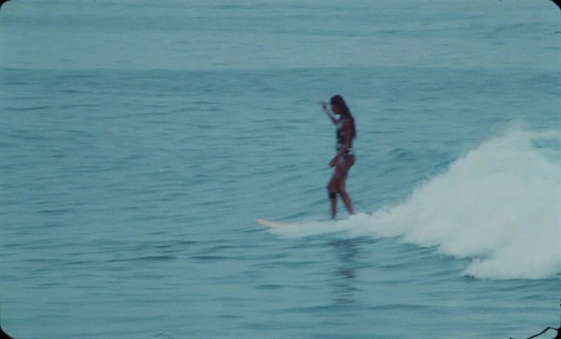 The view is of people surfing on the ocean