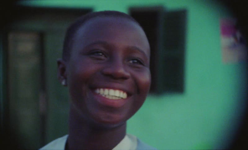 Portrait of a female smiling while standing outdoors