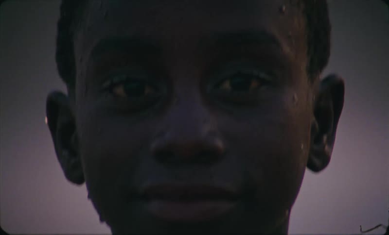 Close up portrait of a child standing outdoors